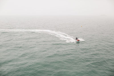 High angle view of man jet boating in sea