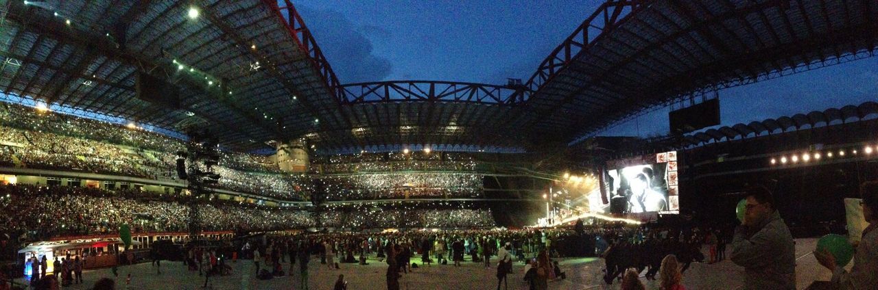 indoors, large group of people, built structure, architecture, illuminated, men, crowd, ceiling, person, transportation, night, lifestyles, low angle view, glass - material, railroad station, travel, leisure activity, sky, public transportation