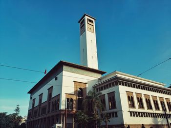 Low angle view of building against clear blue sky