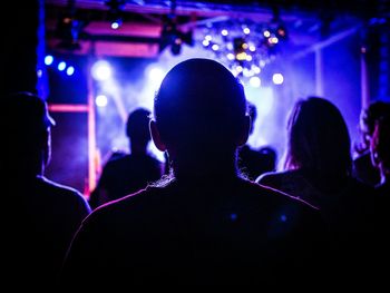 Silhouette of woman in music concert