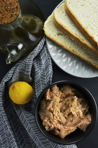 Raw taramas, olive oil , lemon and slices of bread ,ingredients to make taramosalata