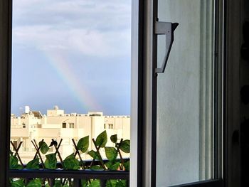 Panoramic view of rainbow over building