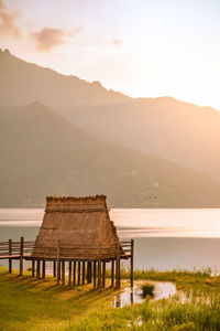 Scenic view of lake against sky during sunset