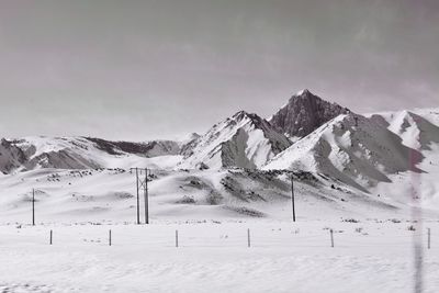 Scenic view of snow mountains against sky