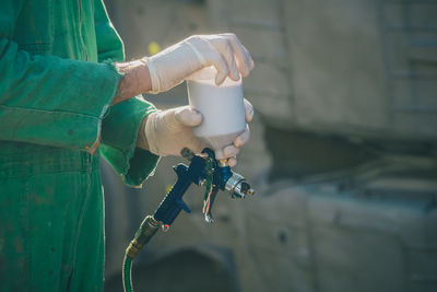 Close-up of man holding camera