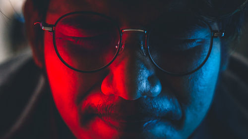 Close-up portrait of man wearing sunglasses