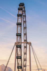 Low angle view of crane against sky