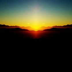 Scenic view of mountains at sunset