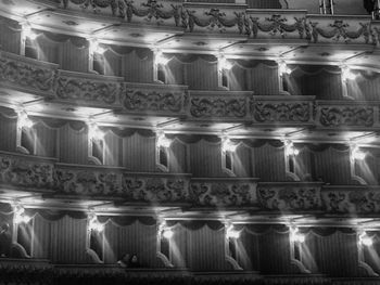 Full frame shot of illuminated lighting equipment at night