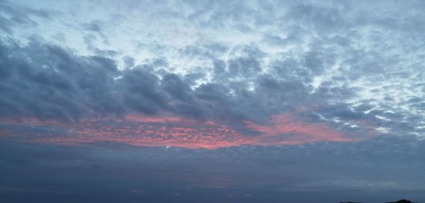 Low angle view of clouds in sky during sunset