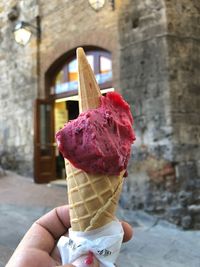 Hand holding ice cream cone