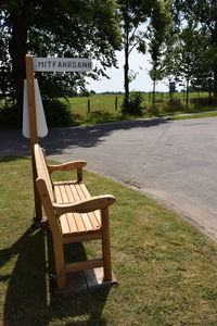 Empty chairs and table in park