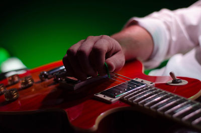 Midsection of man playing piano