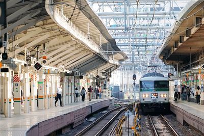 People at railroad station platform