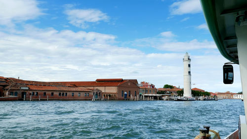 View from the sea to the venetian islands. blue sea, sky, summer day. burano, murano, san michele