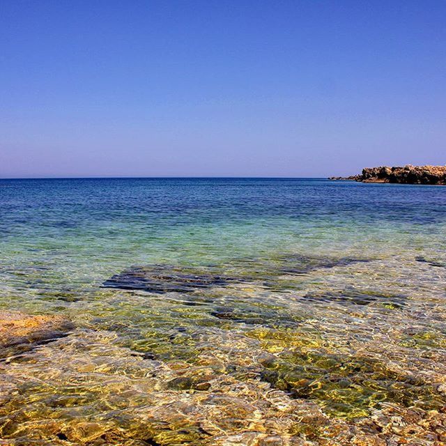 water, clear sky, sea, horizon over water, copy space, tranquil scene, blue, scenics, tranquility, beauty in nature, nature, idyllic, seascape, rippled, calm, shore, beach, remote, outdoors, non-urban scene