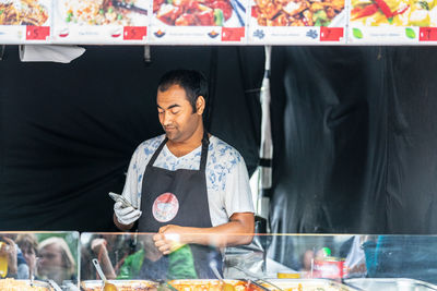 Man working at market stall
