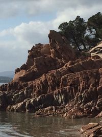 Scenic view of rocks and sea against sky