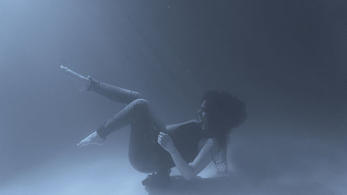 Woman swimming underwater