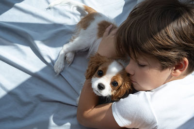 Close-up of boy with dog
