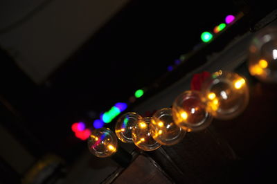 Low angle view of illuminated lighting equipment