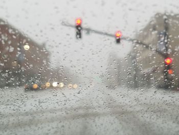 Close-up of wet car on street