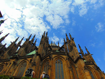 Low angle view of building against cloudy sky