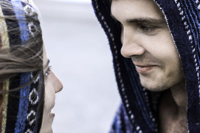 Close-up of couple face to face standing outdoors