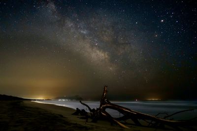 Scenic view of sea against sky at night