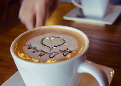 Close-up of cappuccino on table