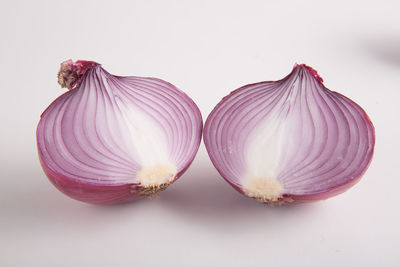 Close-up of garlic over white background