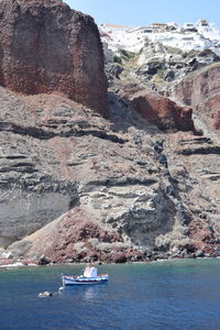 Scenic view of sea by rock formation