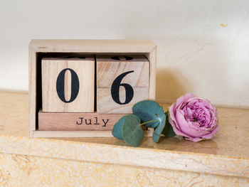 Close-up of pink roses on table