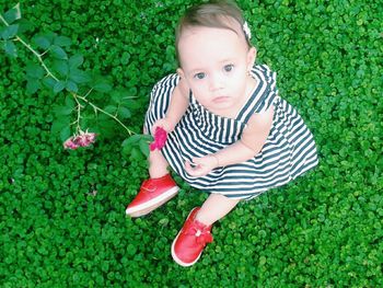 Portrait of girl lying on grass