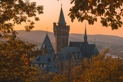 Buildings against sky during autumn