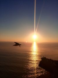 Scenic view of sea at sunset