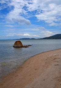 Scenic view of sea against cloudy sky