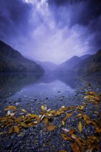 Scenic view of lake and mountains against sky