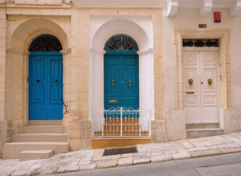 Traditional vintage painted wooden door and exterior in malta. entrance to typical maltese houses.