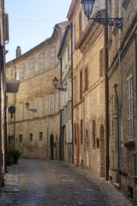 Narrow street amidst buildings in town