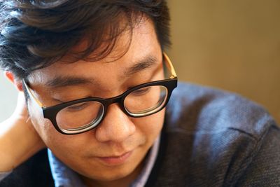 Close-up portrait of young man with eyeglasses