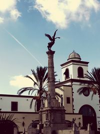 Low angle view of statue against sky