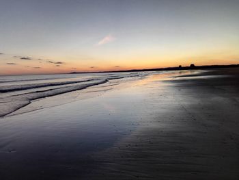 Scenic view of sea at sunset