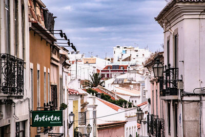 Buildings in city against sky