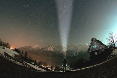 Panoramic view of landscape against sky at night