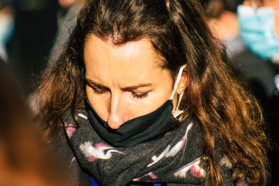 Close-up portrait of woman in winter