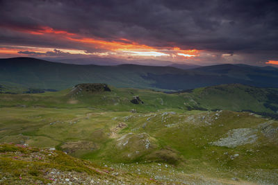 Scenic view of mountains against sky during sunset