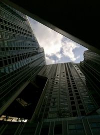 Low angle view of skyscraper against sky