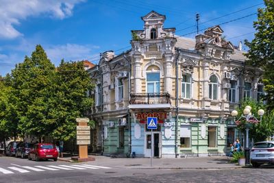 Street by building against sky