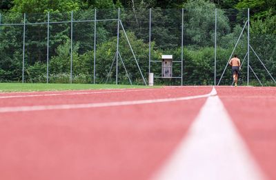 View of man running on track